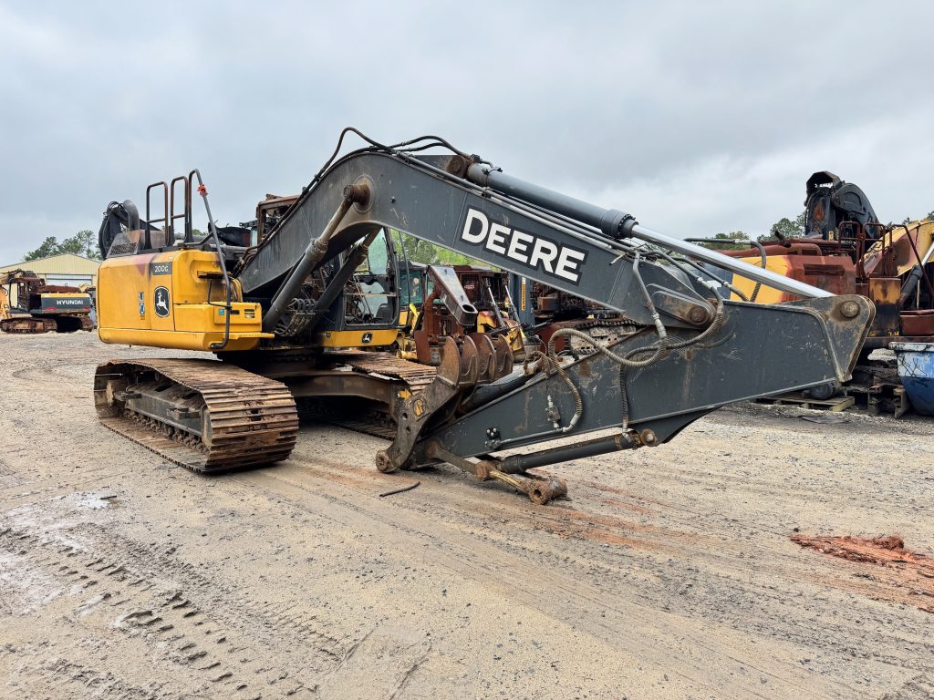 2022 John Deere 200G LC excavator being dismantled for used parts at a forestry salvage yard